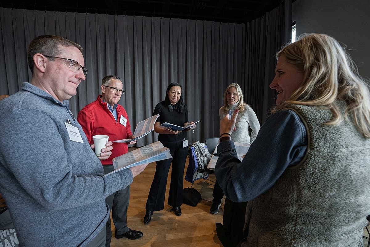 Five people having a small group discussion at Summit. 