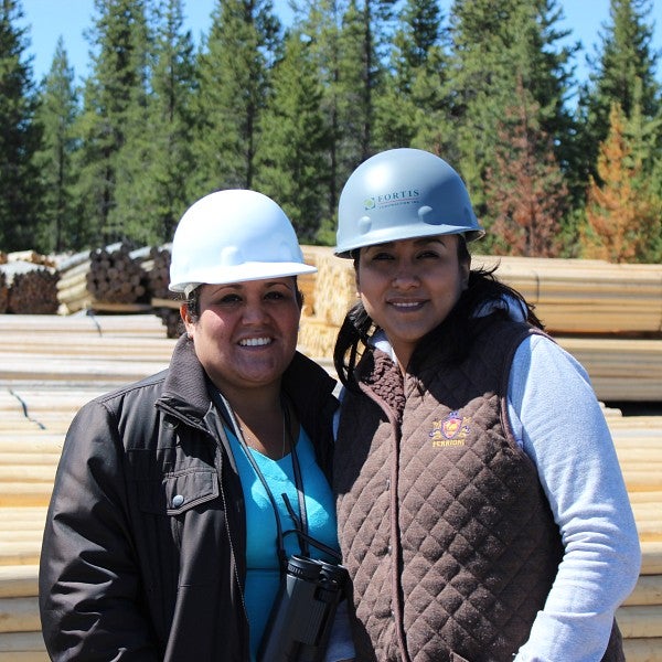 two people wearing hard hats
