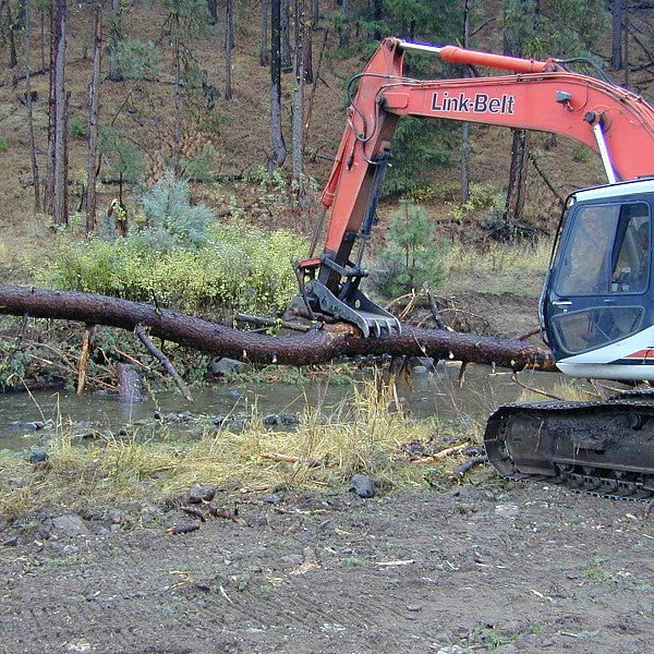 machine picking up log