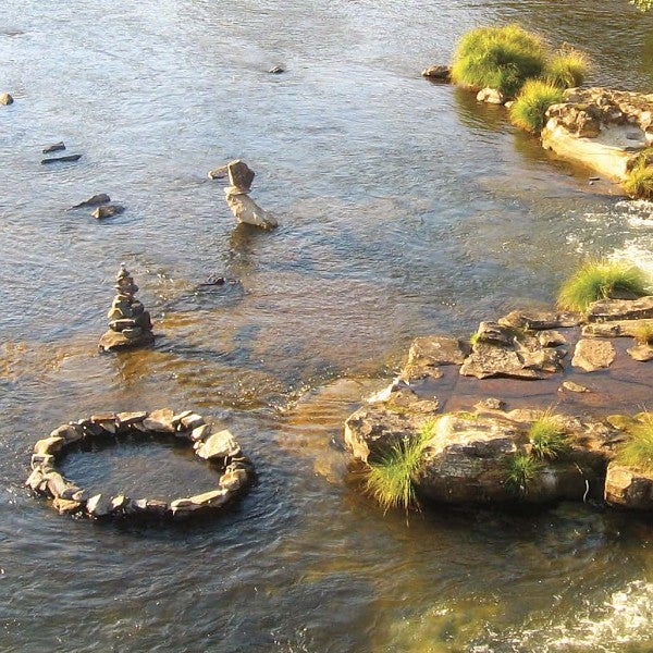 Rocks forming an O in river